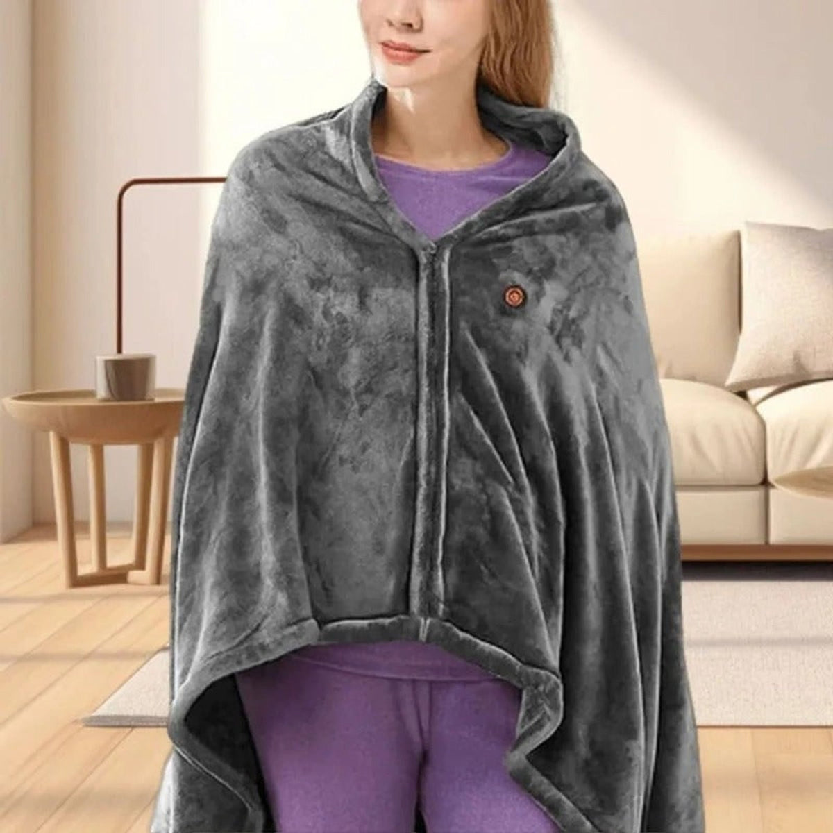 Front of grey wearable heated blanket showing snap closure and chest control