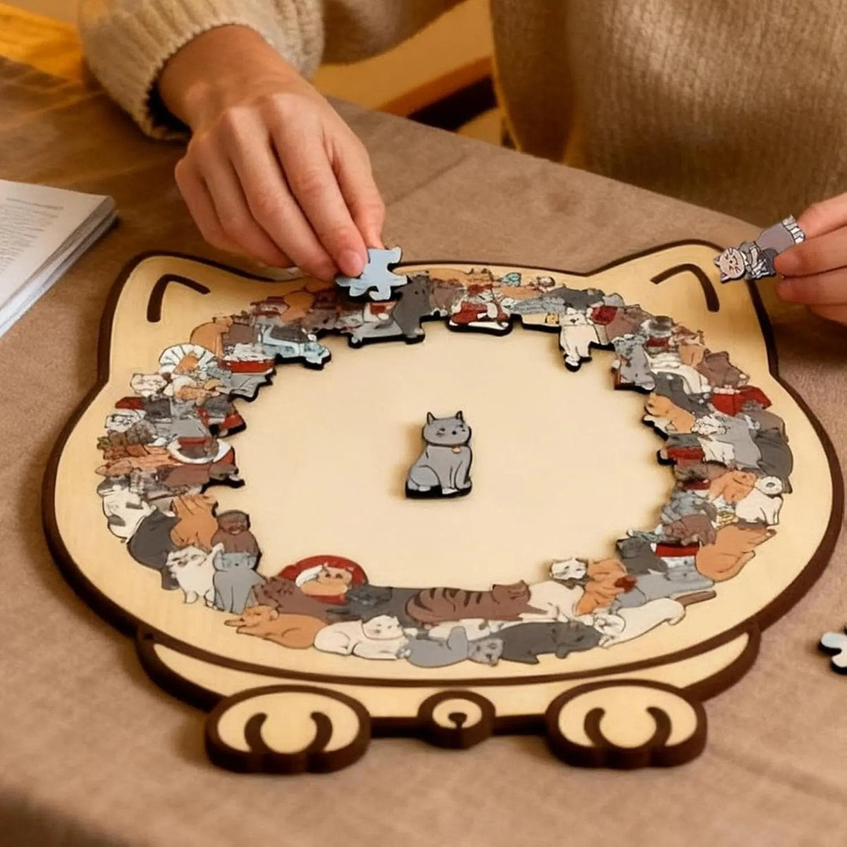 Assembled cat-shaped wooden jigsaw with smaller cat pieces
